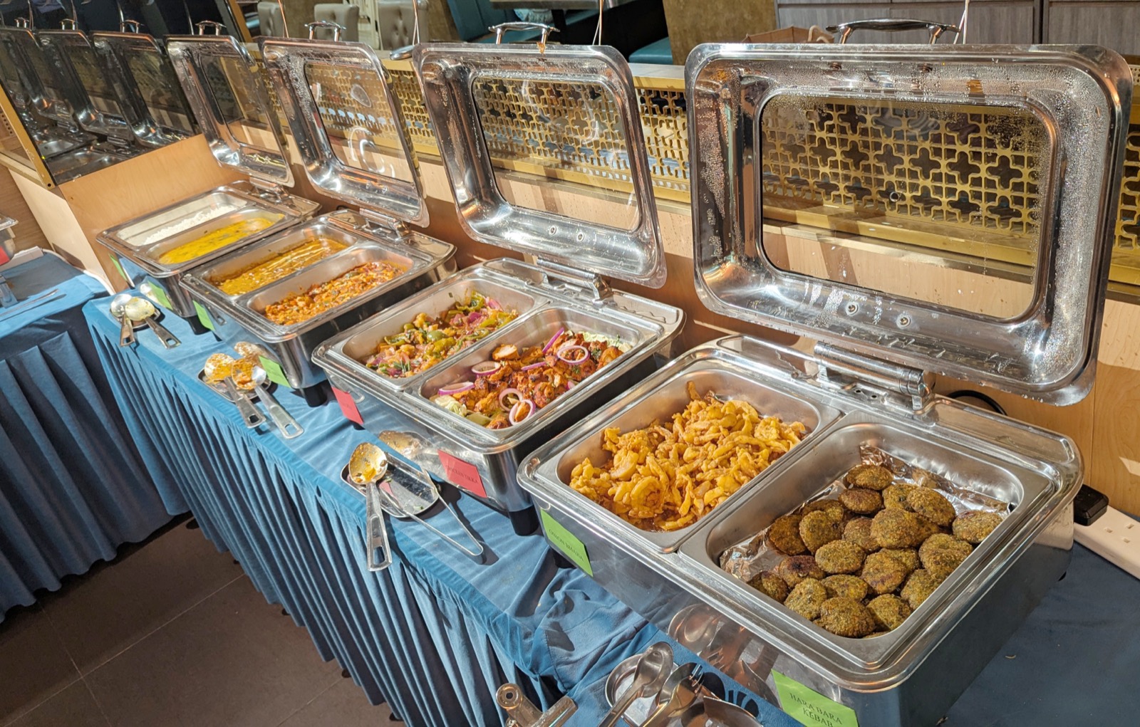 Sunday buffet spread at Woodlands Wan Chai with onion bhajia, hara bhara kebab, tikka and assorted curries